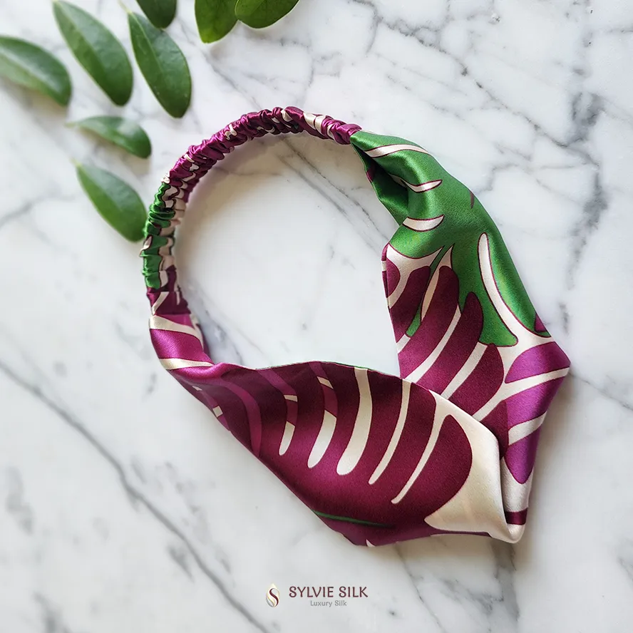 Monstera silk charmeuse headband in magenta, green, and ivory botanical print