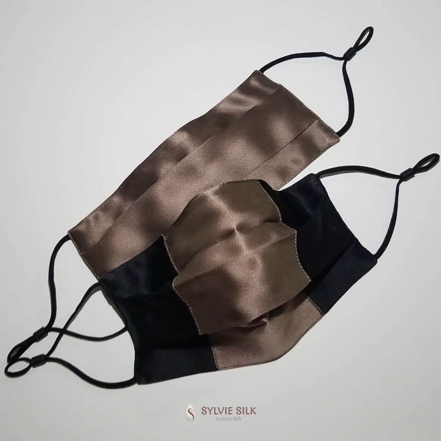 Black and mocha silk face masks with adjustable ear loops by Sylvie Silk