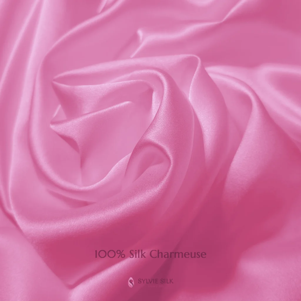 Pink Lotus 100% silk charmeuse fabric with luminous folds and a smooth lustrous face