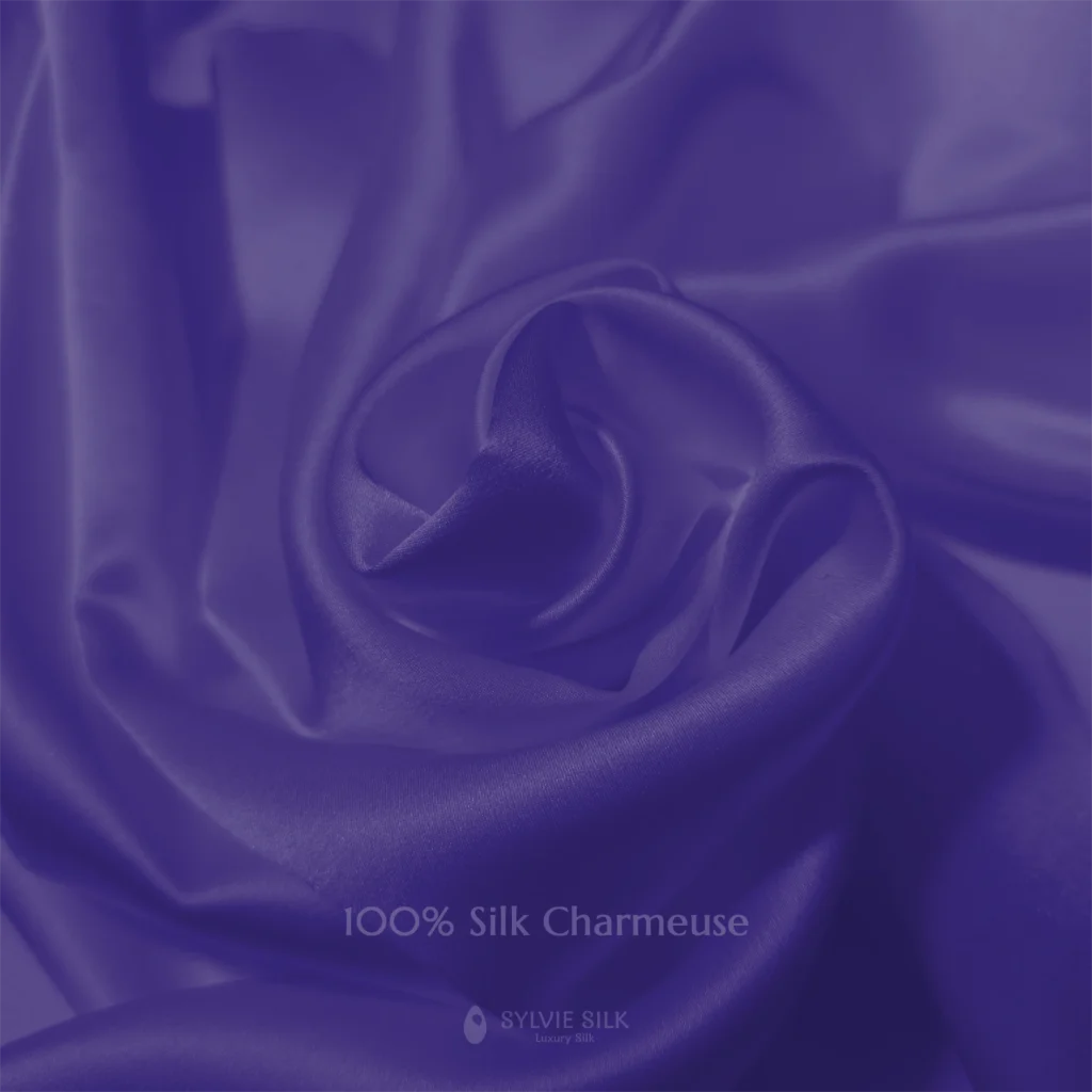 Royal Purple 100% silk charmeuse fabric with luminous folds and a smooth lustrous face