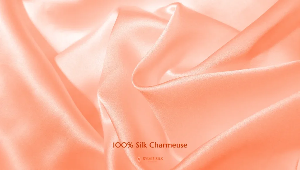 100% silk charmeuse fabric with a smooth lustrous face orange color