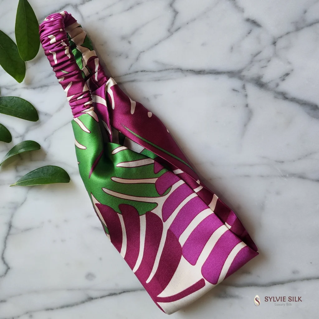 Sylvie Silk Monstera silk charmeuse flat headband in magenta, green and ivory with silk-covered elastic back